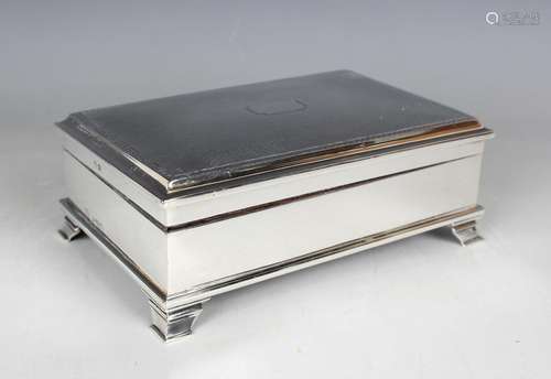 A George V silver rectangular trinket box with engine turned...