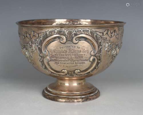 An Edwardian silver circular rose bowl, embossed with floral...