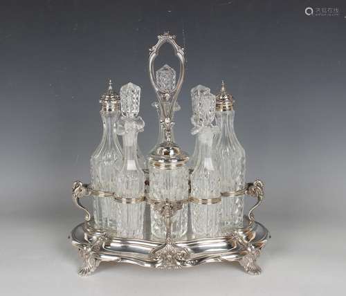 A late Victorian plated eight-bottle cruet stand with centra...