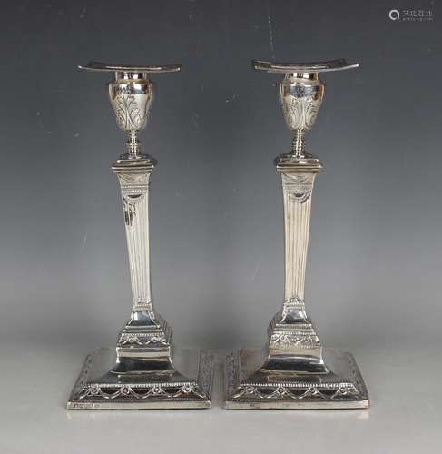 A pair of George III silver Neoclassical candlesticks, each ...