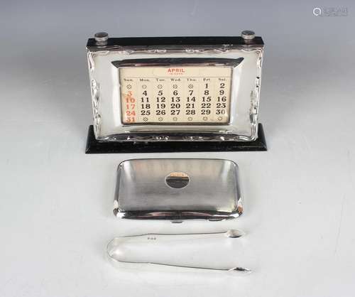 A George V silver curved rectangular cigarette case with eng...