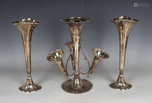 An Edwardian silver epergne, the central trumpet vase framed...