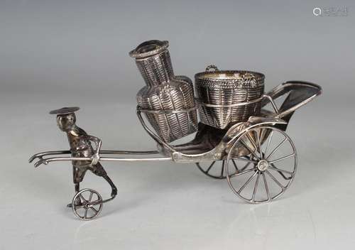 A Chinese sterling silver condiment stand, modelled as a man...