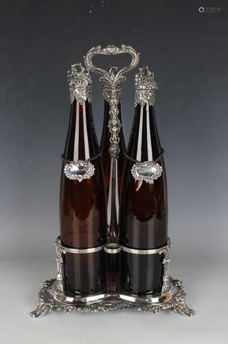 An early Victorian Sheffield plate three-bottle decanter sta...