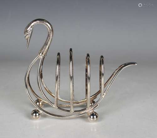 An Elizabeth II silver four-division toast rack in the form ...