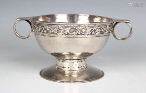 An Arts and Crafts style silver two-handled bowl, the hammer...