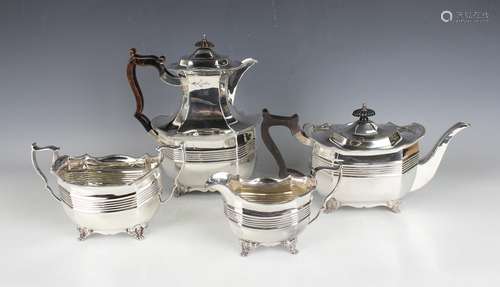 A late Victorian silver four-piece tea set of canted corner ...