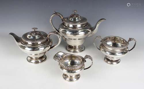 A George IV silver four-piece tea set, comprising teapot, ho...