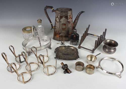 A group of plated items, including a coffee pot with engrave...