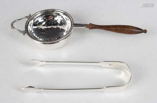 A pair of George IV silver Fiddle pattern sugar tongs, Londo...