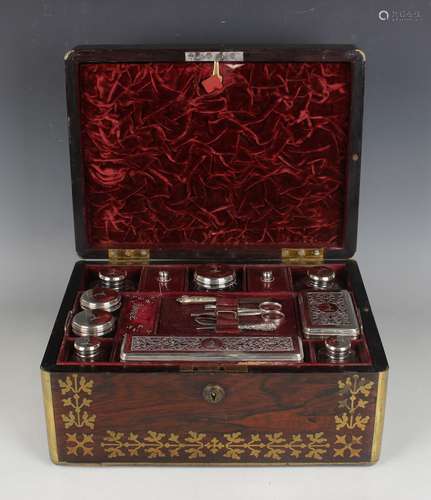 A George IV brass inlaid rosewood vanity case, the interior ...