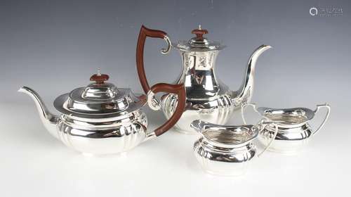 An Elizabeth II silver four-piece tea and coffee set of cush...