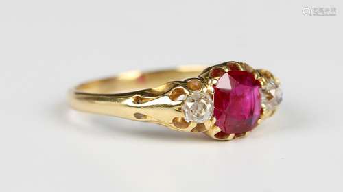 A gold, ruby and diamond three stone ring, claw set with the...