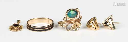 A 9ct gold ring, mounted with an oval opal doublet and a flo...