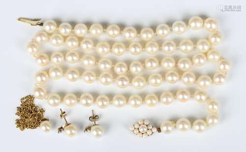 A single row necklace of uniform cultured pearls on a 9ct go...