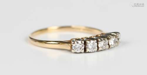 A gold and diamond five stone ring, claw set with a row of c...