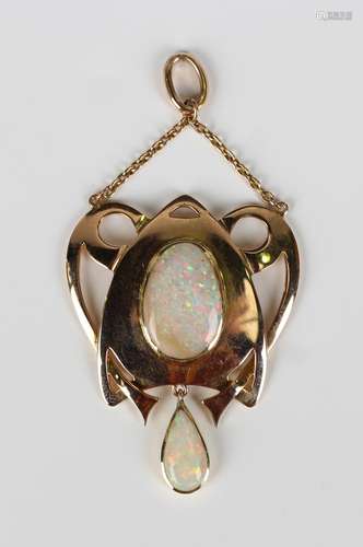 A gold and opal pendant in an Art Nouveau inspired design, c...