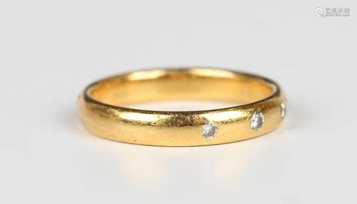 A 22ct gold and diamond three stone wedding ring, gypsy set ...