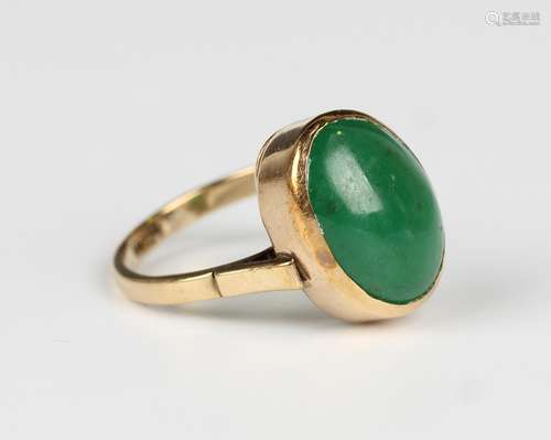 A gold and oval cabochon jade solitaire ring, detailed 9ct, ...