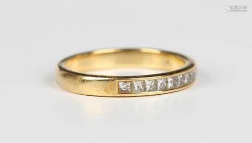 An 18ct gold and diamond ring, mounted with a row of ten pri...