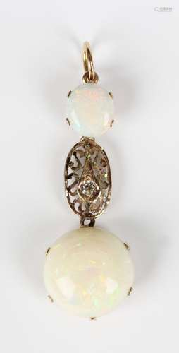 A gold, opal and diamond pendant, claw set with the principa...