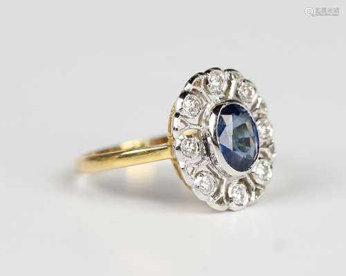 A sapphire and diamond oval cluster ring of pierced openwork...