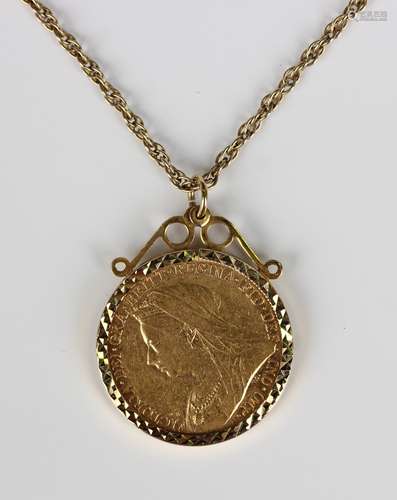 A Victorian Old Head sovereign 1897M in a 9ct gold pendant m...