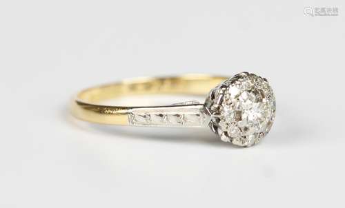 A gold, platinum and diamond cluster ring, mounted with the ...