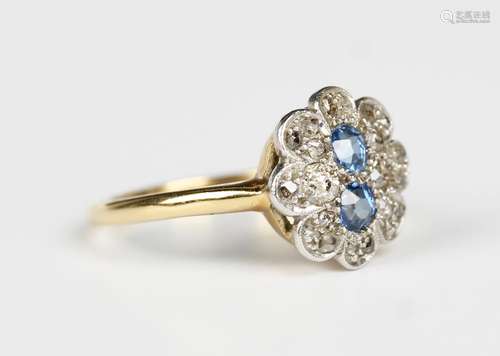 A gold, sapphire and diamond cluster ring, mounted with two ...