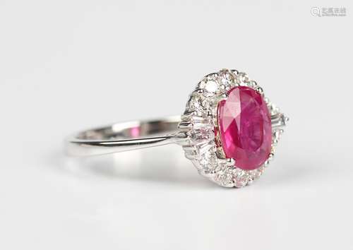 A white gold, treated ruby and diamond cluster ring, claw se...