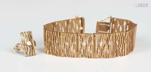 A 9ct gold bracelet in a rectangular panel shaped link desig...