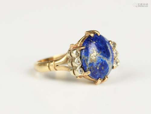 A gold, lapis lazuli and diamond ring, claw set with the ova...