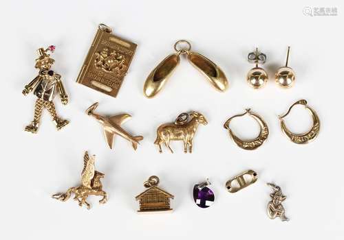 Four 9ct gold pendants and charms, comprising a pair of slip...