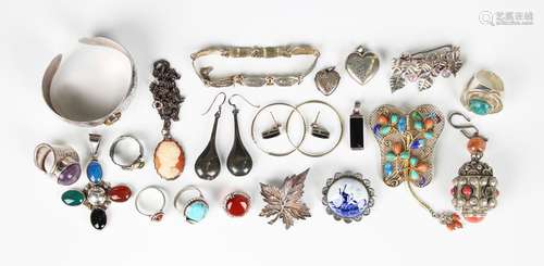 A group of mostly silver jewellery, comprising five brooches...