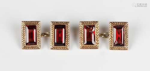 A pair of gold and garnet rectangular cufflinks, each mounte...