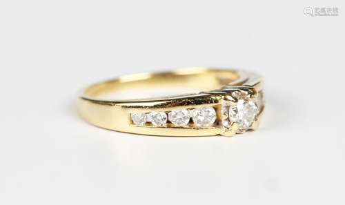 An 18ct gold and diamond ring, claw set with the principal c...