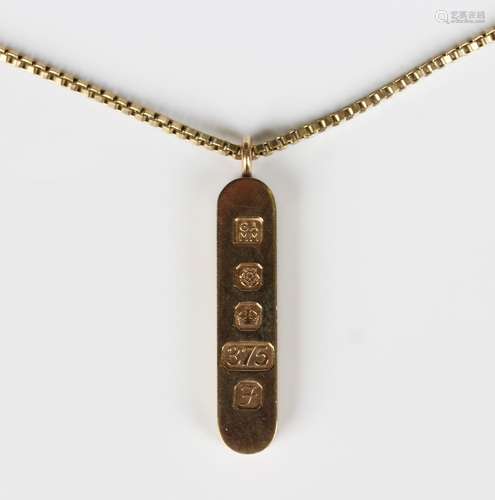 A 9ct gold ingot pendant, Sheffield 1980, length 4.1cm, with...