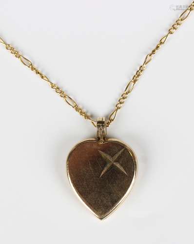 A 9ct gold heart shaped pendant locket, length 2.7cm, with a...