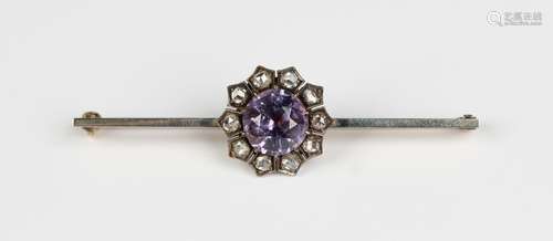 A diamond and mauve spinel cluster bar brooch, claw set with...