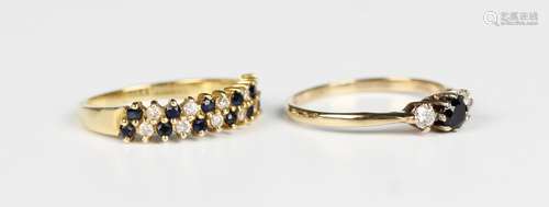 An 18ct gold, sapphire and diamond ring, claw set with two r...