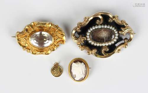 A Victorian gold and rock crystal shaped oval brooch, mounte...