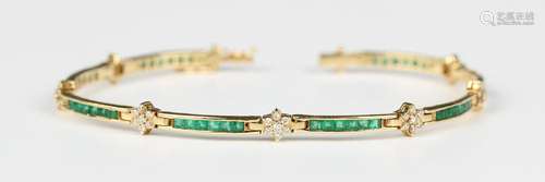 A gold, emerald and diamond bracelet in a curved bar and clu...