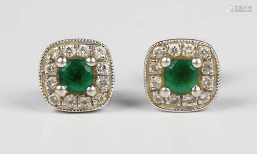 A pair of 18ct white gold, emerald and diamond square cluste...