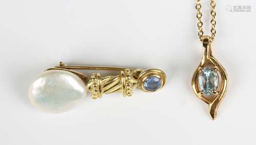 A gold, sapphire and freshwater cultured pearl brooch in a c...