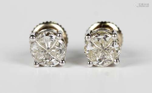 A pair of 18ct white gold and diamond earstuds, each claw se...