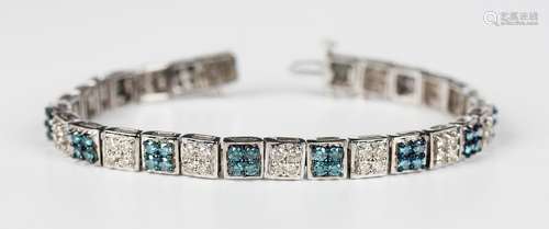 A white gold, treated blue diamond and diamond bracelet, for...