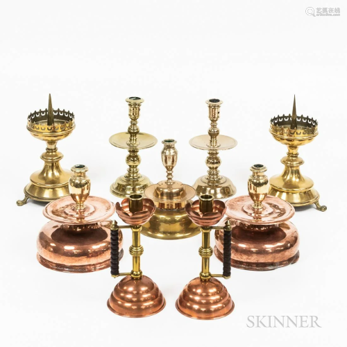 Nine Brass and Copper Candlesticks, including a pair after a...