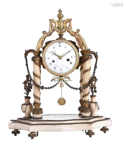 AN ALABASTER AND GILT METAL MOUNTED MANTEL CLOCK