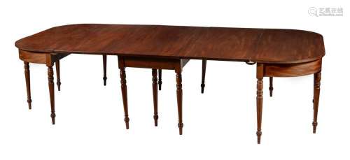 A LATE GEORGE III MAHOGANY DINING TABLE