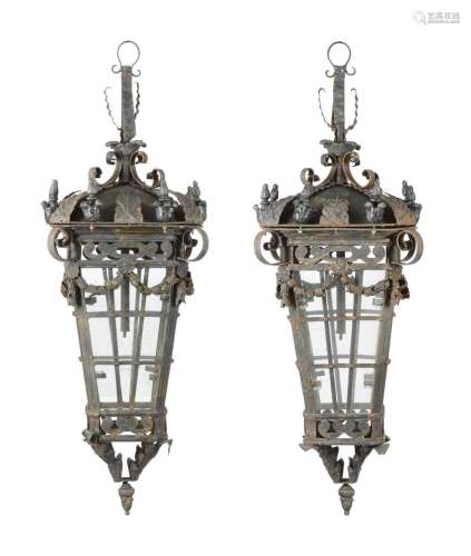 A PAIR OF BLACK PATINATED METAL FOUR GLASS LANTERNS